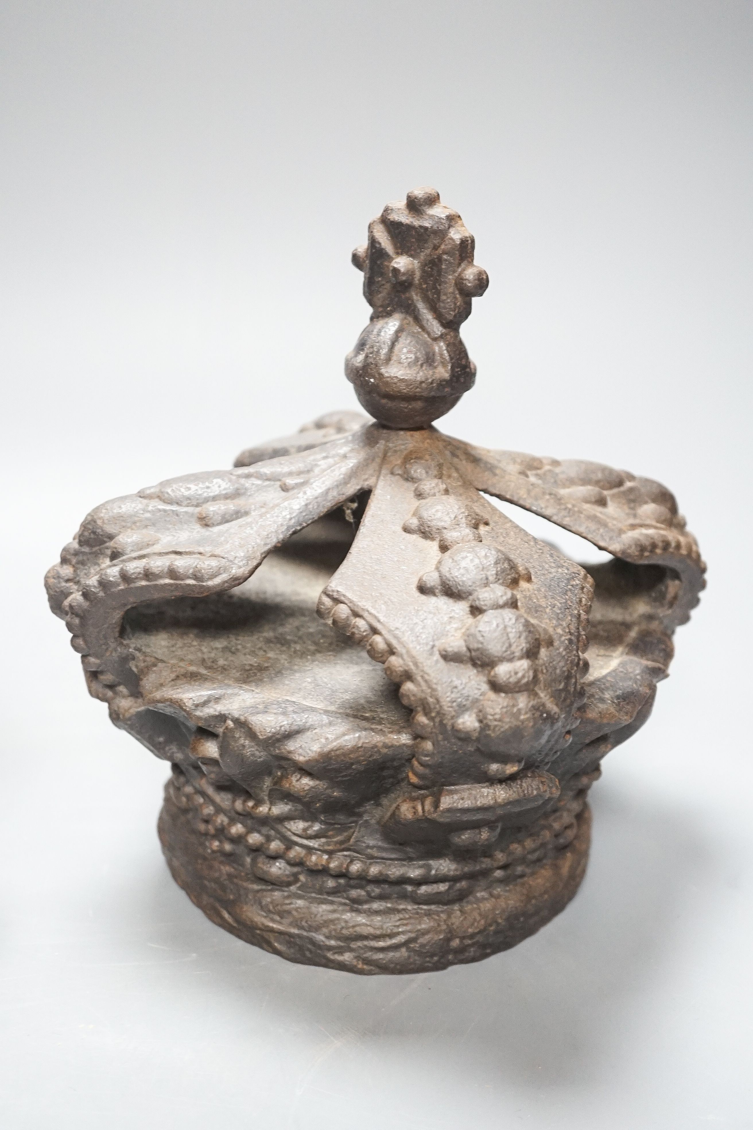 A Victorian cast iron model of a crown and a carved wood crown appliqué 21cm